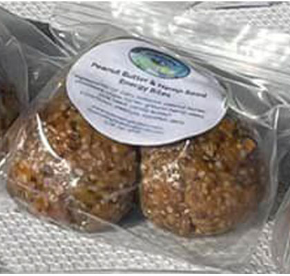 picture of three peanut butter and hemp seed energy bites
