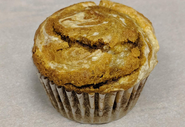 closeup of gluten-free pumpkin cream cheese muffin